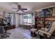 Bright living room with tile floors, large windows, and comfortable seating arrangement at 5931 33 N Ave, St Petersburg, FL 33710