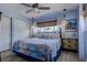 Serene bedroom with blue walls, coastal accents, and comfortable queen bed at 5931 33 N Ave, St Petersburg, FL 33710