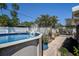 Sparkling above-ground pool surrounded by lush landscaping and a charming patio area at 5931 33 N Ave, St Petersburg, FL 33710