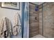 Bathroom shower featuring modern tile, updated fixtures, and a decorative shower curtain at 5931 33 N Ave, St Petersburg, FL 33710