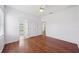 Spacious bedroom with hardwood floors and ample natural light at 6518 Paw Pl, Land O Lakes, FL 34639