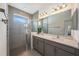 Bathroom showcasing a glass-enclosed shower, double sink vanity, and modern fixtures at 672 Old Windsor Way, Spring Hill, FL 34609