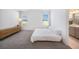 Bedroom featuring a minimalist aesthetic, gray carpet, and natural light from the windows at 672 Old Windsor Way, Spring Hill, FL 34609