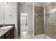 Bathroom featuring a tiled shower and a view of the connecting bedroom at 6872 40Th N Ln, Pinellas Park, FL 33781