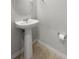A pedestal sink is a small space solution that gives the bathroom an open feel at 6872 40Th N Ln, Pinellas Park, FL 33781