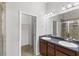 Bathroom features double sinks, granite counters, and a separate shower and walk-in closet at 6872 40Th N Ln, Pinellas Park, FL 33781