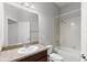 Bathroom featuring a shower-tub, vanity with granite countertop and ample lighting at 6872 40Th N Ln, Pinellas Park, FL 33781