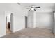 Large bedroom featuring a ceiling fan, carpeted floors, and multiple closets at 6872 40Th N Ln, Pinellas Park, FL 33781