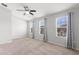 Bright bedroom with large windows and neutral carpet creating an open and airy feel at 6872 40Th N Ln, Pinellas Park, FL 33781