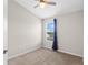 Bedroom with neutral color scheme, plush carpet, ceiling fan and natural light from the window at 6872 40Th N Ln, Pinellas Park, FL 33781