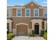 Charming townhome showcasing a well-maintained facade and design elements for curb appeal at 6872 40Th N Ln, Pinellas Park, FL 33781