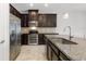 Contemporary kitchen featuring stainless steel appliances, granite countertops, and a convenient island with bar seating at 6872 40Th N Ln, Pinellas Park, FL 33781
