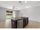 Modern kitchen island with granite countertops, providing bar seating and a view of the patio at 6872 40Th N Ln, Pinellas Park, FL 33781