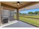 Covered screened patio offering a relaxing outdoor space with views of the backyard and landscaping at 6872 40Th N Ln, Pinellas Park, FL 33781