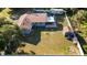 An aerial view of the property features a well-maintained yard, storage shed and RV area at 6907 W Creek Dr, Tampa, FL 33615