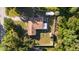 Overhead view of the property features lush surroundings, fenced yard, and a dedicated RV area at 6907 W Creek Dr, Tampa, FL 33615