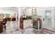 Charming bar area featuring decorative shelving, a wine fridge, and a tiled backsplash at 6907 W Creek Dr, Tampa, FL 33615