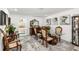 Elegant dining area featuring a glass-top table and view of the main bedroom at 6907 W Creek Dr, Tampa, FL 33615