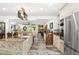Modern kitchen with granite countertops, stainless steel appliances, and an open layout at 6907 W Creek Dr, Tampa, FL 33615