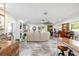 Spacious living room with white walls, elegant furniture, and marble floors, offering comfort and style at 6907 W Creek Dr, Tampa, FL 33615