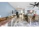 Outdoor kitchen features stainless steel appliances, marble counter and dining area at 6907 W Creek Dr, Tampa, FL 33615