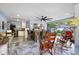 Outdoor kitchen with spacious island bar, ceiling fan, and cozy sitting area at 6907 W Creek Dr, Tampa, FL 33615
