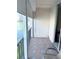 Private balcony with tile flooring and scenic views of the water, perfect for relaxation at 7645 Sun Island S Dr # 306, South Pasadena, FL 33707