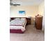 Bright bedroom featuring a comfortable bed, wooden furniture, and a ceiling fan for added comfort at 7645 Sun Island S Dr # 306, South Pasadena, FL 33707