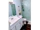 Bathroom with a sink and a shower with frosted glass and foliage design on the door at 8004 25Th W Ave, Bradenton, FL 34209