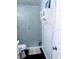 Bathroom features a tiled shower with frosted glass door and mounted storage cabinet at 8004 25Th W Ave, Bradenton, FL 34209
