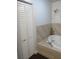 Large soaking tub with tile surround in Primary bathroom at 8004 25Th W Ave, Bradenton, FL 34209