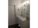 Bathroom with white marble-look vanity and modern fixtures at 8004 25Th W Ave, Bradenton, FL 34209