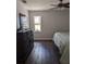Bedroom with bed, dresser, and bright light at 8004 25Th W Ave, Bradenton, FL 34209
