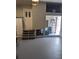 Well-organized garage interior with visible storage solutions, a separate door with steps, and ladder at 8004 25Th W Ave, Bradenton, FL 34209