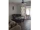 Living room featuring hardwood floors and sliding glass doors with decorative curtain at 8004 25Th W Ave, Bradenton, FL 34209