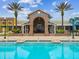 Outdoor pool area and Splash Garden with a brick entrance and landscaping offering relaxing recreation at 8227 Bird Whistle Ln, Land O Lakes, FL 34637