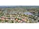 Aerial view of the Placidio Bayou community, showcasing the homes, lake, and lush landscape at 915 Live Oak Ne Ter, St Petersburg, FL 33703