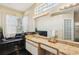 A luxurious bathroom features a granite countertop, a soaking tub, and a large window at 915 Live Oak Ne Ter, St Petersburg, FL 33703