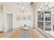 Charming dining area with a window overlooking the pool and decorated with coastal-themed artwork at 915 Live Oak Ne Ter, St Petersburg, FL 33703