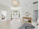 Spacious open foyer with transom windows, white double doors, and a view into other rooms at 915 Live Oak Ne Ter, St Petersburg, FL 33703