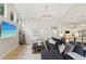 Open living area features a large sofa, accent lighting, and flows into the kitchen at 915 Live Oak Ne Ter, St Petersburg, FL 33703