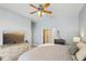 Relaxing bedroom with neutral colors and a view of the en-suite bathroom and walk-in closet at 915 Live Oak Ne Ter, St Petersburg, FL 33703
