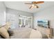 Bedroom featuring a sliding glass door leading to the pool and a view of the backyard at 915 Live Oak Ne Ter, St Petersburg, FL 33703