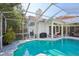 Outdoor pool with screened lanai, BBQ, outdoor seating, and access to the home at 915 Live Oak Ne Ter, St Petersburg, FL 33703