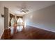 Bedroom featuring wood floors, ceiling fan, curtains, and a sliding glass door at 9159 Highland Ridge Way, Tampa, FL 33647