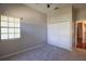 This bedroom features a neutral color palette, a window for natural light, and a double door closet for storage at 9159 Highland Ridge Way, Tampa, FL 33647