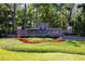 Hunter's Green community entrance with manicured landscaping at 9159 Highland Ridge Way, Tampa, FL 33647