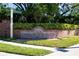 Osprey Pointe community entrance with brick columns and lush greenery at 9159 Highland Ridge Way, Tampa, FL 33647