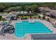 Large community pool with a water slide, sun loungers and a well-maintained deck at 9159 Highland Ridge Way, Tampa, FL 33647