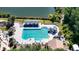 Expansive community pool with a slide, covered seating, and scenic water views at 9159 Highland Ridge Way, Tampa, FL 33647